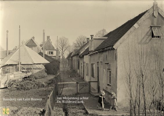 0117_Jan_Meiersteeg_achter_de_Willibrordkerk
Links de boerderij van L.Bouwer,met de oude vuilniswagen.
Kuijerpad, voorheen Jan Meijersteeg
